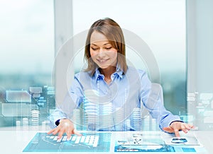 Woman pointing to buttons on virtual screen