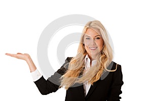 woman pointing to cpoy space - holding arm as presenting a product
