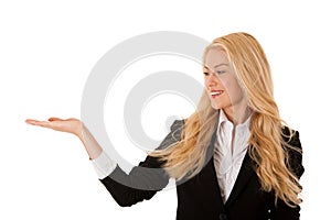 woman pointing to cpoy space - holding arm as presenting a product