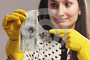 Woman pointing to the wet money (money laundering)
