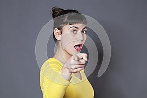 Woman pointing with a you did it expression