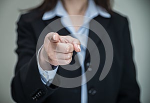 Woman pointing at you with one finger