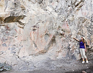 A Woman Points Out Pictographs at the Gila Cliff Dwellings