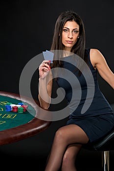 woman with poker cards and chips