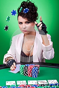 Woman with poker face making a bet