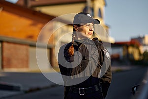 Woman police officer in uniform outdoors portrait