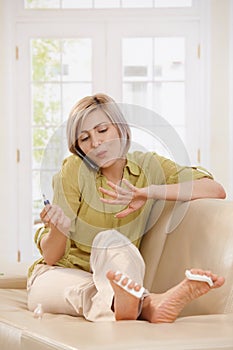 Woman polishing nails