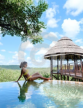 woman by the pool on a luxury safari,South Africa