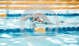 Woman, pool and swimming in sports fitness, exercise or training in water splash or athletics. Female person, athlete or