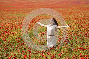 Woman in poppy field