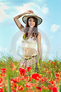 Woman in poppy field