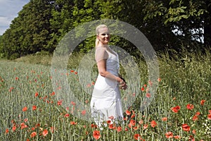 Woman in poppy field