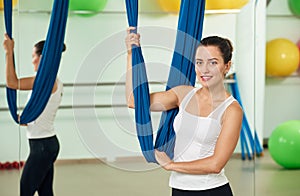 Woman portrait about aerial yoga hammock