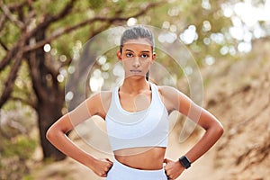 Woman, portrait and athlete for fitness in nature, runner and body wellness or health in forest for workout. Sports