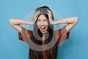 Woman portrait background blue happy studio trendy attractive lifestyle asian smile girl