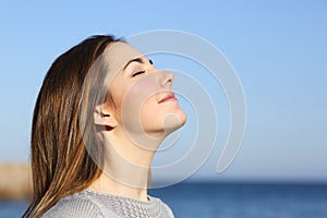 Woman portrait breathing deep fresh air