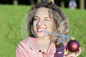 Woman portrait with a Christmas toy.