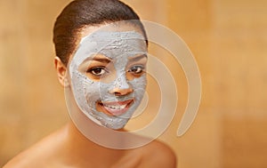 Woman, portrait and clay mask at spa, facial treatment and detox or cleaning cosmetics. Female person, beauty and