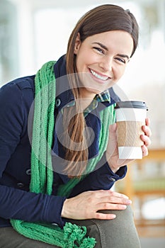 Woman, portrait and coffee in cafe for winter day to relax for peace or tranquility, happy and pleasure. Female student