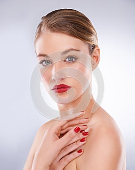 Woman, portrait and cosmetics in studio with red lipstick for makeup, beauty and aesthetic with nail polish. Model