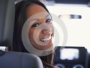 Woman, portrait and driving in car for road trip, travel and happy on journey with transportation. Face of a young