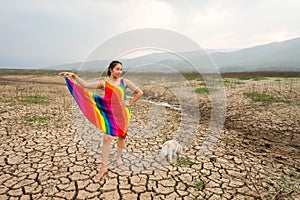 Woman portrait in dryland with drought ground texture. concept climate changed.