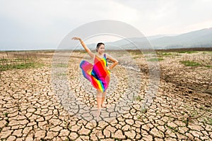 Woman portrait in dryland with drought ground texture. concept climate changed.