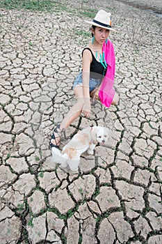 Woman portrait in dryland with drought ground texture. concept climate changed.