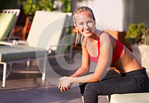 Woman, portrait and fitness outdoor on patio for health, wellness and sportswear for workout at home. Relax, training or