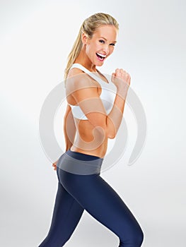 Woman, portrait and flex in studio for fitness or health with exercise for slim body, athletic and workout for weight