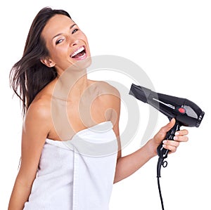 Woman, portrait and hairdryer for beauty treatment in studio with salon tool with towel for morning routine, white