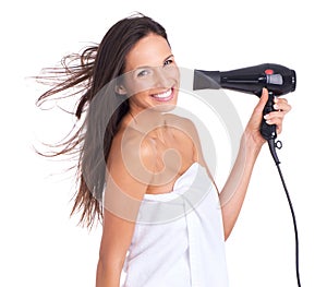 Woman, portrait and hairdryer in studio or style treatment on white background with towel for cleaning, morning or care