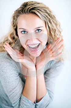 Woman, portrait and hands face for fun play, confidence or attractive smile. Female person, happy emoji gesture and