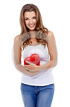 Woman, portrait and heart for love in studio, smiling and confidence with emoji on white background. Female person