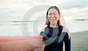 Woman, portrait and laughing for surfing at beach, sea and ocean on summer holiday, travel adventure or fun. Happy