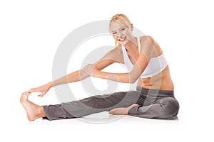 Woman, portrait and leg stretching in studio for flexibility practice for workout warm up or yoga, wellness or white
