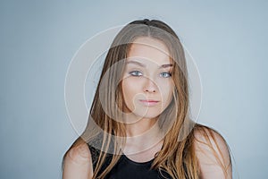 Woman portrait natural beautiful. Portrait of a beautiful girl in studio. Posing for university photo.