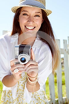 Woman portrait, photographer or vintage camera in holiday location, summer vacation or Germany sightseeing break. Smile