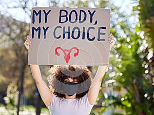 Woman, portrait and poster for outdoor protest on abortion, body choice or freedom of human rights. Feminism, cardboard