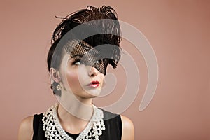 Woman Portrait in Retro Black Hat with a Veil