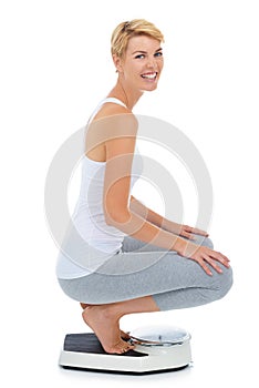 Woman, portrait and on scale in studio for weight loss, healthcare and wellness for vitality. Female person, diet and