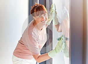 Woman, portrait smile and cleaning window for housekeeping, services or disinfection. Happy female cleaner smiling and