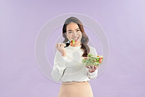 Woman in portrait, smile and eating salad, diet and healthy food with weight loss