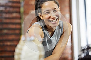 Woman, portrait and stretching with fitness, smile and workout start for health and wellness. Athlete, cardio and warmup