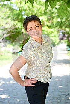 Woman portrait in summer outdoor, happy people, city park