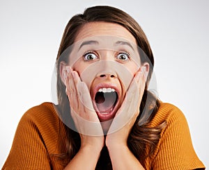 Woman, portrait and surprise with good news, wow or disbelief for special offer on a gray studio background. Face of