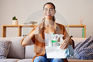 Woman, portrait and thumbs up for home, cleaning and housekeeping with container of product tools. Happy cleaner, maid