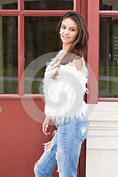 woman portrait of young pretty trendy girl posing at the city in Europe in summer street fashion