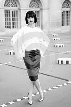 Woman pose in courtyard of paris, france