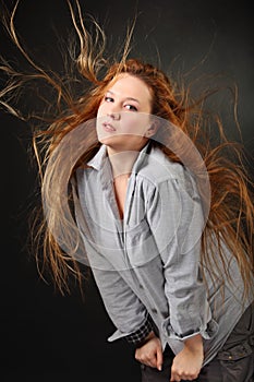 Woman pose in shirt with hair fluttering